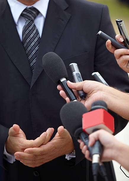 istock business meeting conference journalism microphones 491521285