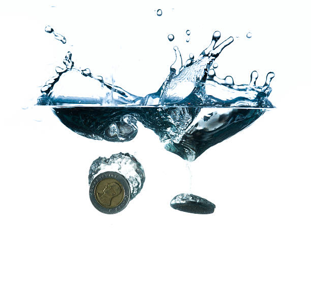 istock money in water with bubbles on white background 491523415