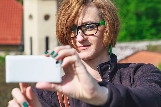istock Woman taking photo with cellphone 491523741