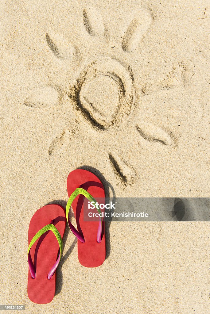 Summer beach Summer theme with red flip flop on sandy beach Backgrounds Stock Photo