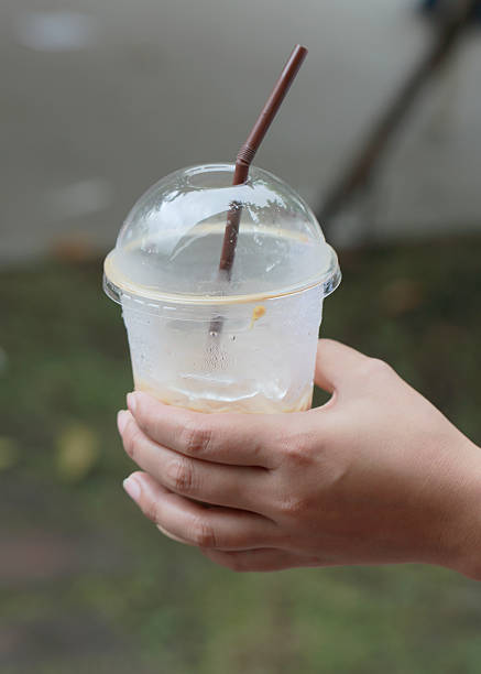 istock woman's hand hold ice coffee cup 491526790