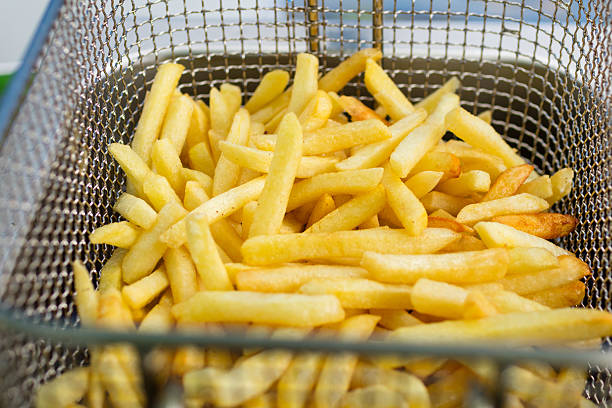 istock cooking french fries 491527022