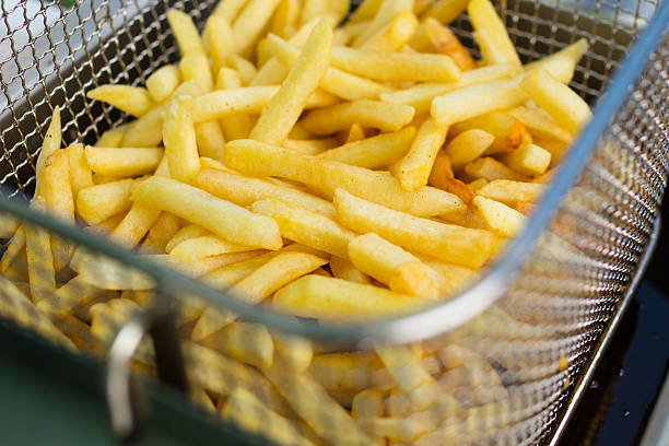 istock cooking french fries 491527106