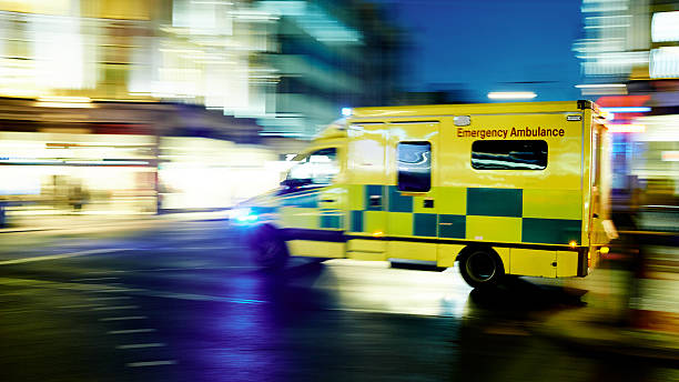 Speeding ambulance Ambulance car moving at night ambulance photos stock pictures, royalty-free photos & images