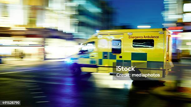 Speeding Ambulance Stock Photo - Download Image Now - Ambulance, Emergency Services Occupation, Accidents and Disasters
