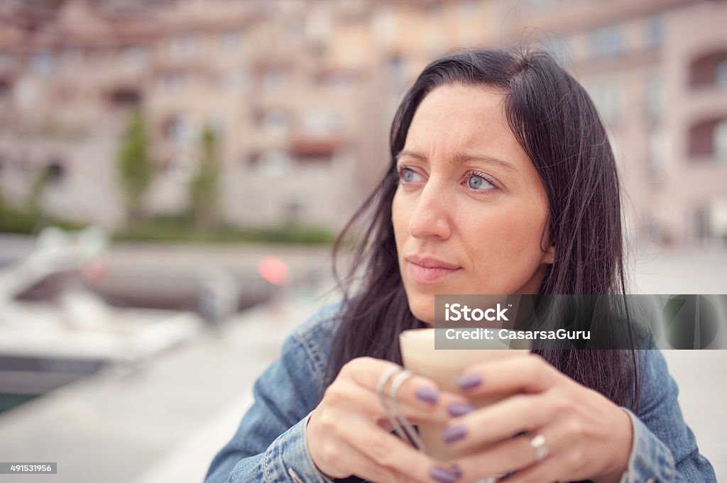 Woman Drinking Coffee in a Bar Outdoors, Close-up Young Woman Portrait Outdoors drinking coffee 2015 Stock Photo