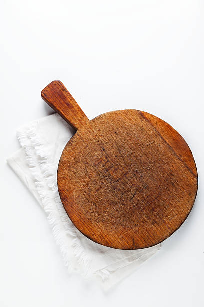 istock Chopping cutting board on white with seasoning 491539874