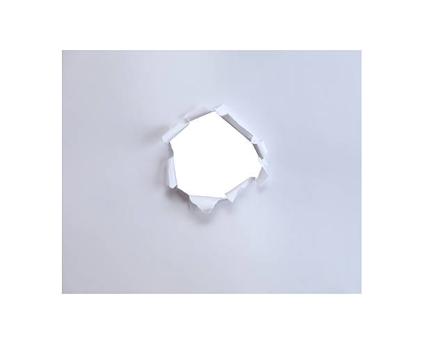 istock Hole in the paper with torn sides. 491541248