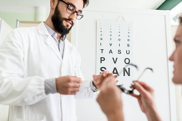 istock Ophthalmologist doctor talking with the patient 491541406