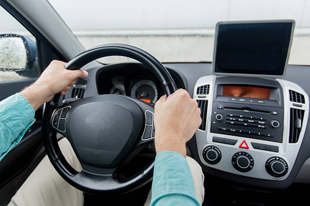 istock close up of young man with tablet pc driving car 491541522