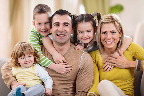 istock Loving family enjoying at home looking at camera. 491542276