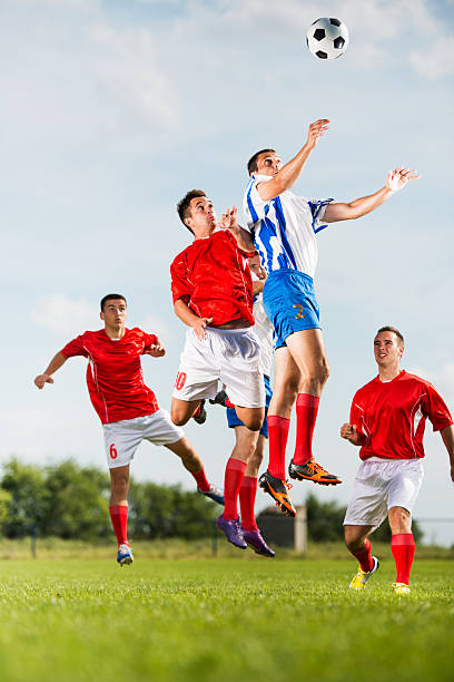 istock Soccer players heading the ball during a match. 491543966