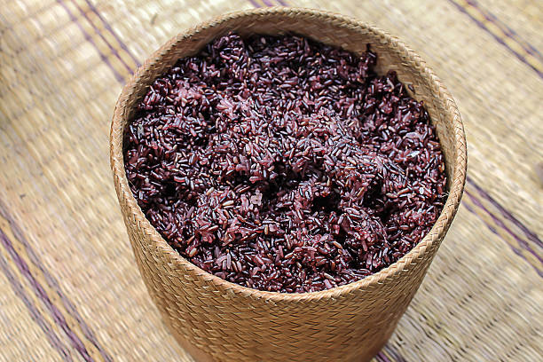 istock Black sticky rice on  wicker container on the mat. 491544034