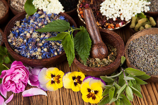 istock Natural medicine, wooden table background 491546248