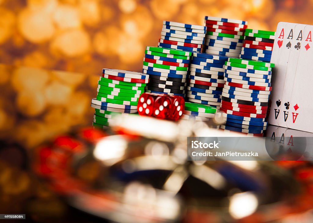 Poker Chips on a gaming with casino roulette 2015 Stock Photo
