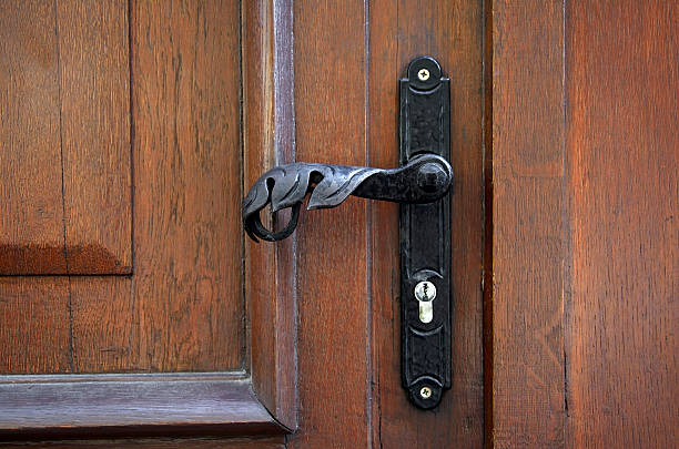 istock metal door handle on the door brown 491559044