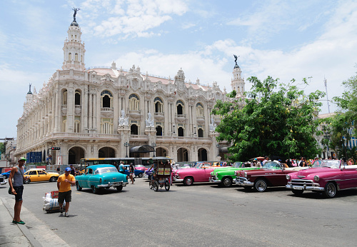 Havana, Cuba - July 30, 2015. Street traffic on the street in Habana Cuba at the the National Theatre. 