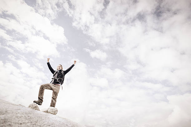 istock Mountain Walking Man Celebrates Reaching the Summit 491560020