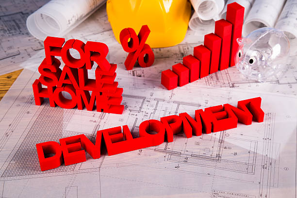 istock Real estate agency concept and blueprints 491560976