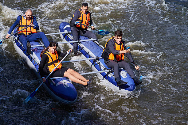 business team avventura - extreme sports rafting team sport white water rafting foto e immagini stock