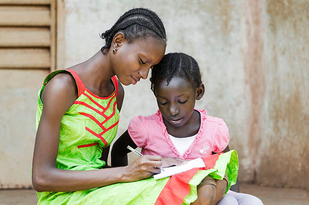 istock Education for Africa: Little black Girls Studying Learning Lesson Symbol 491562646