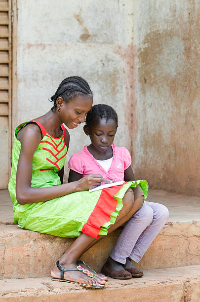 istock Black Girls Studying Together Outside their School 491562678