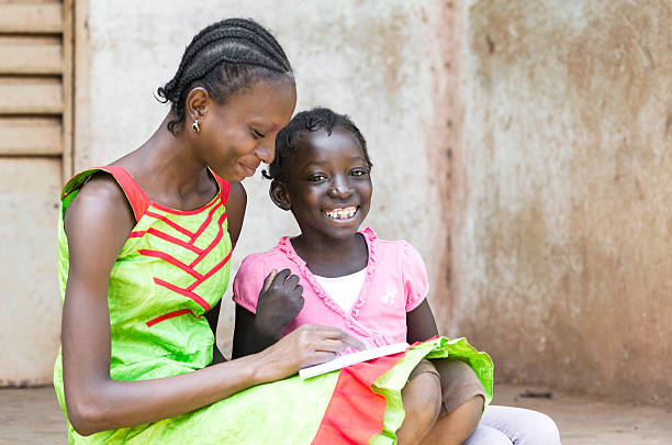 istock Education and Happiness: African Girls Learning Together Their Lessons 491562700