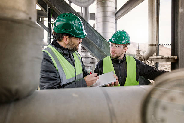 istock Manual workers discussing at factory 491562832