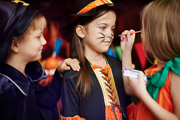 Children love face painting games Children love face painting games halloween face paint stock pictures, royalty-free photos & images