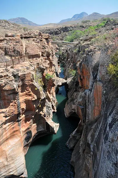 Bourkes Luck Potholes, in Mpumalanga, South Africa after heavy rain makes the main river flow orange