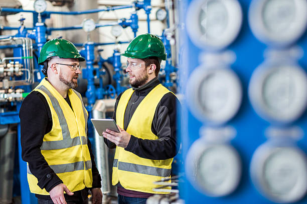 istock Manual workers discussing in factory 491574824