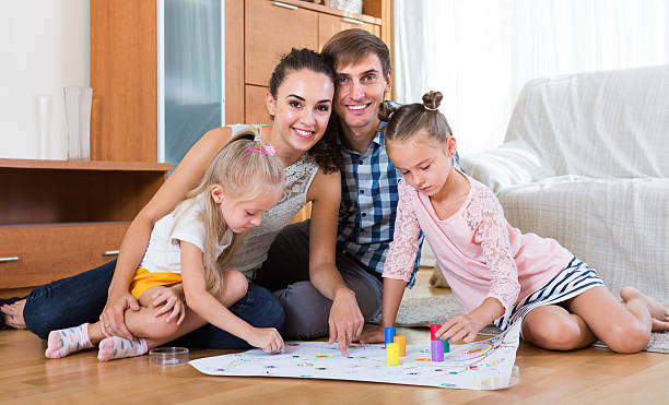 istock Family  playing at board game 491575300