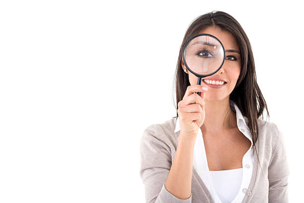 istock Woman holding a magnifying glass searching for something 491575466
