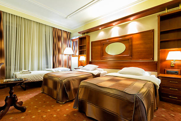 istock Elegant hotel twin bedroom with an extra bed 491576158
