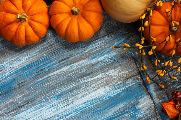istock Pumpkin Background on wood 491576326