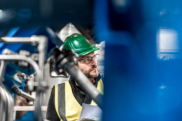istock Manufacturing professional is analysing machines in factory 491576932