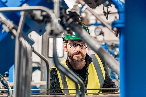 istock Serious and confident manual worker at factory 491577008