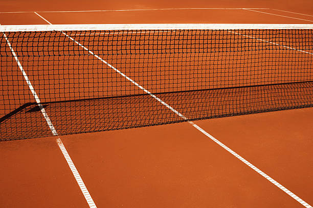istock net on a red clay tennis court 491578060