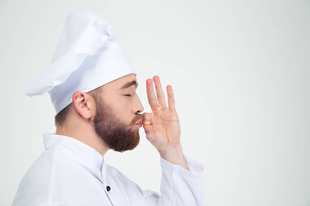 istock Male chef cook smelling something in fingers 491578428