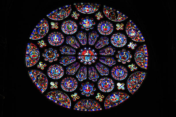 Stained Glass at Chartres Cathedral South transept Rose Window (12th Century) in the Cathedral of Our Lady of Chartres, France. chartres cathedral stock pictures, royalty-free photos & images