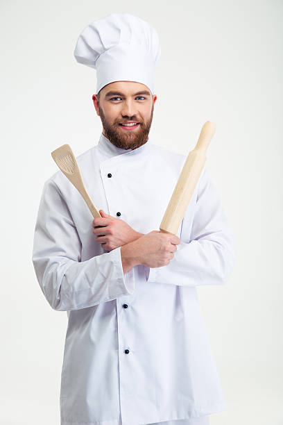 istock Male chef cook holding a rolling pin and spoon 491579452