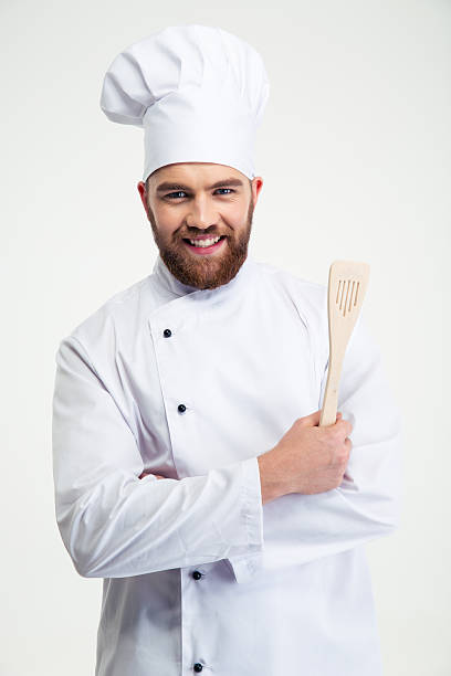 istock Portrait of a smiling chef cook holding spoon 491579502