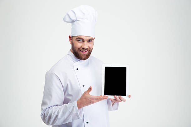 istock Male chef cook showing blank tablet computer screen 491579638