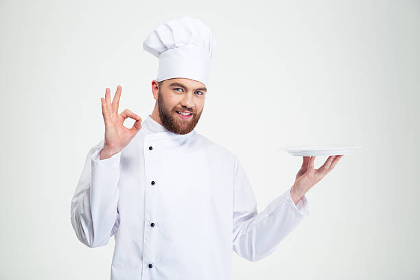 istock Man chef showing ok sign and empty plat 491579690