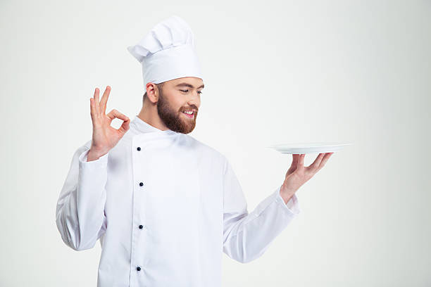 istock Man chef showing ok sign and empty plat 491579726