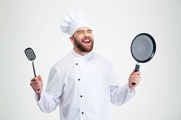 istock Laughing male chef cook holding spoon and pan 491580072