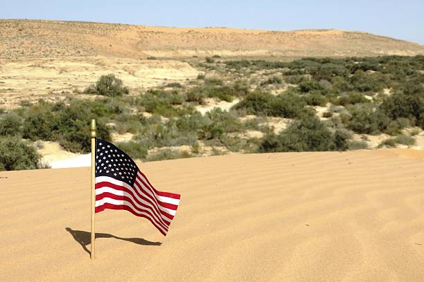 istock American Flag Resting in The Desert 491580236