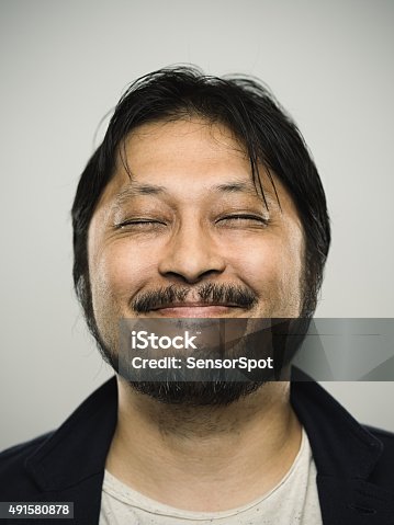 istock Portrait of a happy japanese man looking at camera 491580878