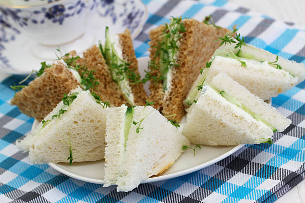 istock White and brown cream cheese and cucumber sandwiches 491581584