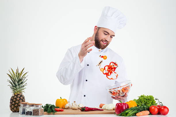 istock Happy male chef cook preparing salad 491582264